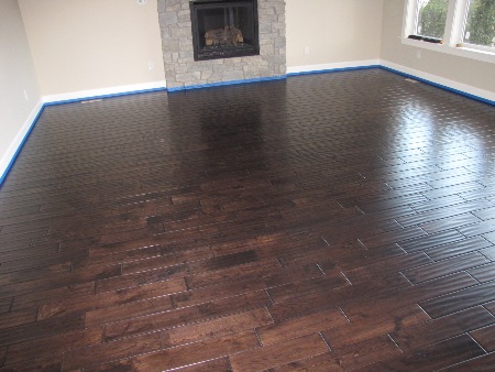 Walnut stained prefinished wood floor installed by Labrador Floors and Tile.