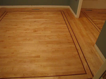 Sand and refinish of old fir floor, with cherry inlay design.
